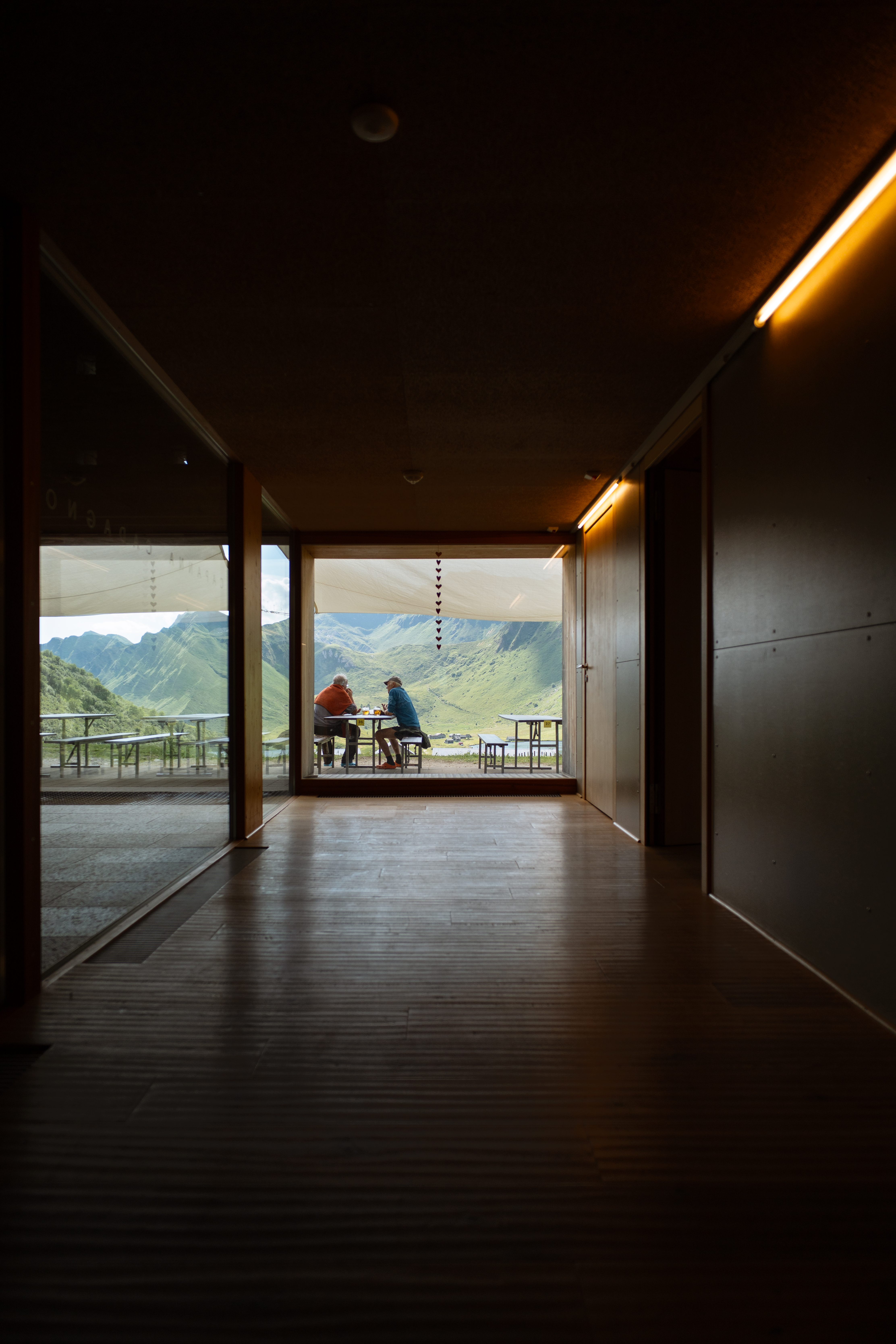 Alpine mountain restaurant interior looking out to the valley